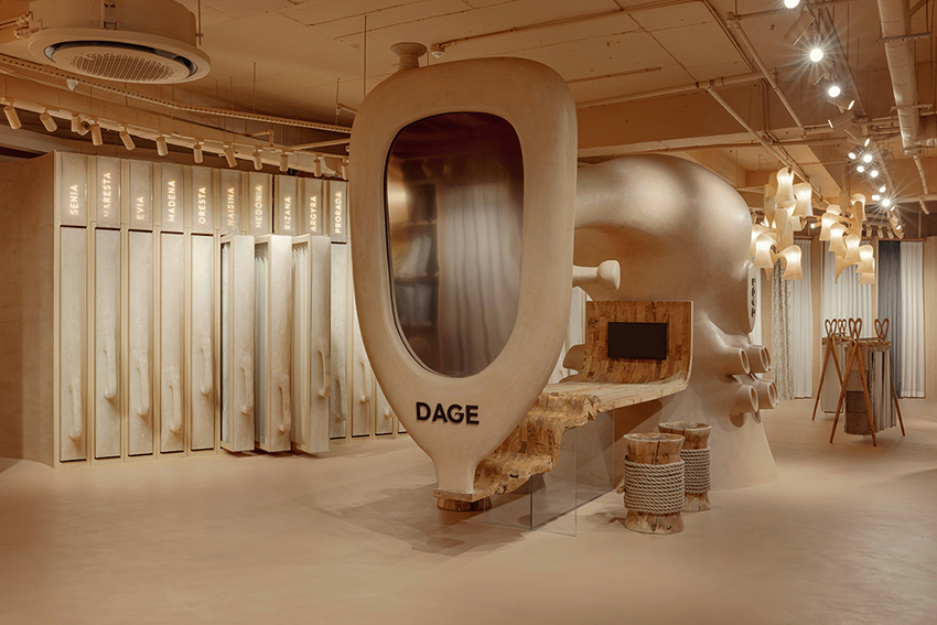 una escultura gigante de una máquina de coser protagoniza la tienda dage curtain de molos