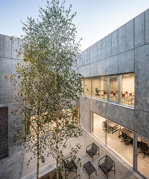 randja architects completa parque tecnológico de piedra y concreto en francia