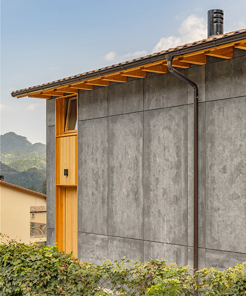 taller SAU eleva la típica casa de granja catalana con concreto y madera en 'vivet houses'