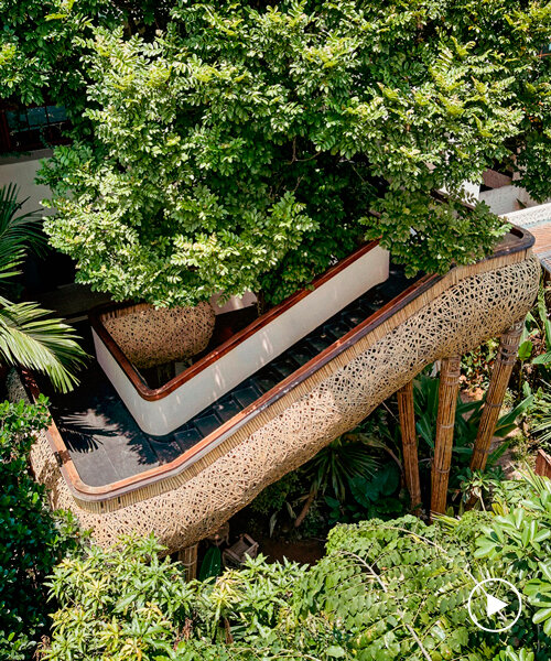 bambú tejido envuelve los paseos flotantes de spa y restaurante en china