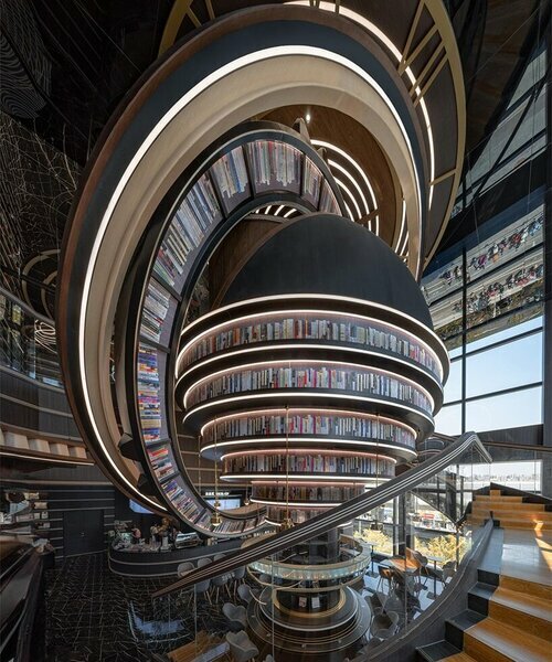colosales anillos celestes animan la librería futurista de x+living en jiangsu, china